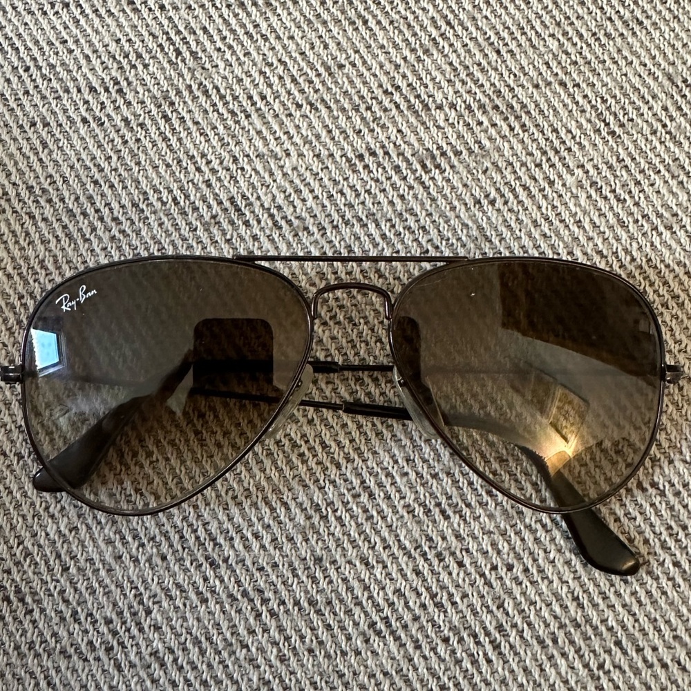 Black rimmed and black lens ray-ban aviator sunglasses